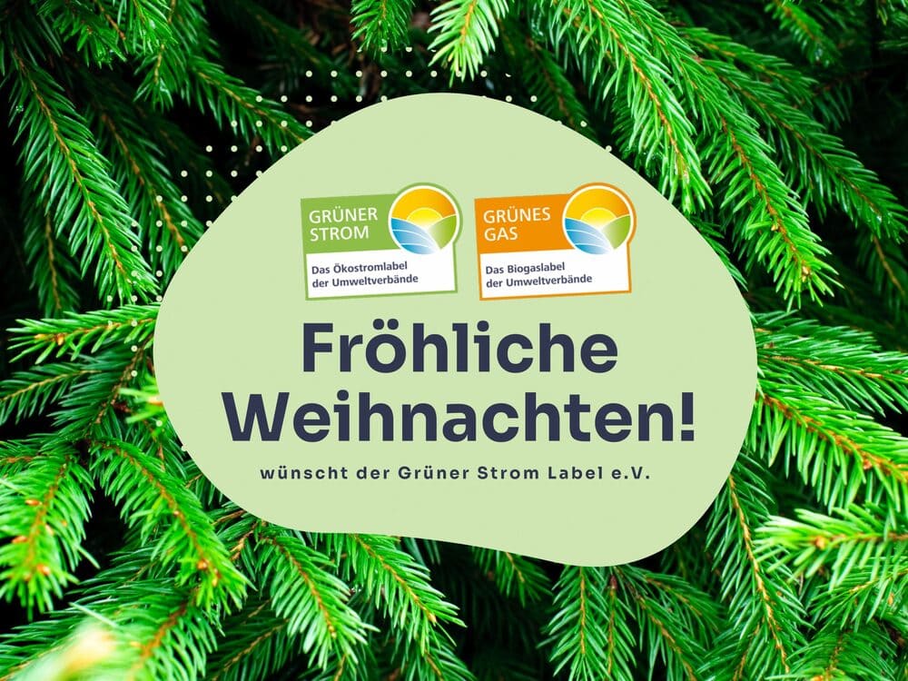 Fir greenery with the inscription "Merry Christmas from Grüner Strom Label e.V."